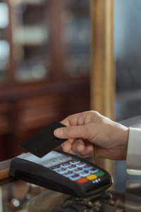 Hand holding a black card