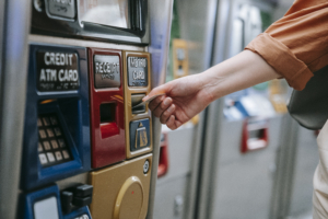 Person inserting card on an automated machine