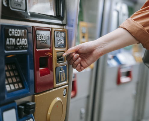 Person inserting card on an automated machine