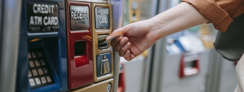 Person inserting card on an automated machine