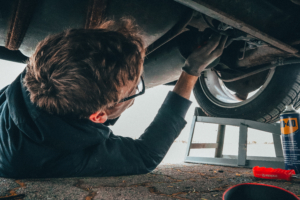 Man fixing vehicle engine